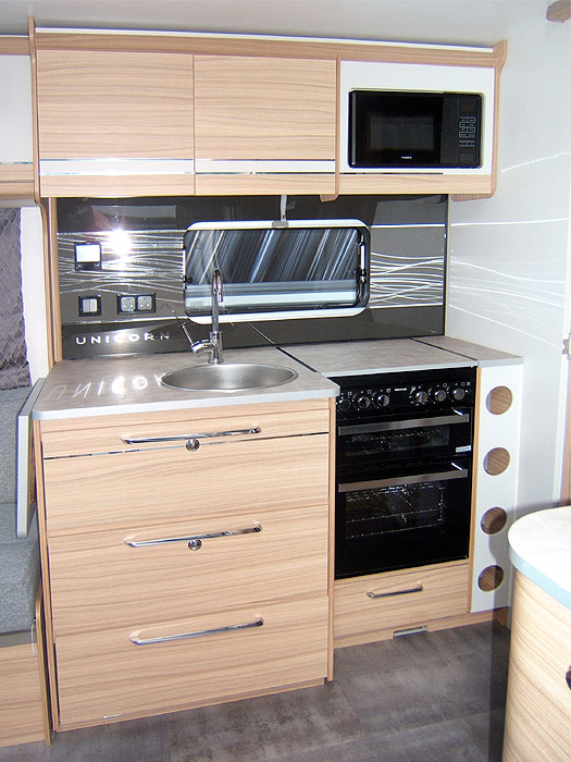 Image showing the TV connection point and power sockets at the very front of the caravan.